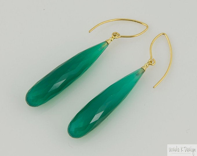 Elegant green teardrop earrings with gold hooks.