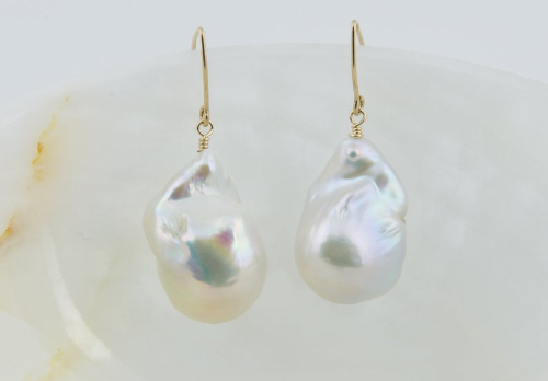 Pearl Drop Earring on a White Earrings With Gold Hooks