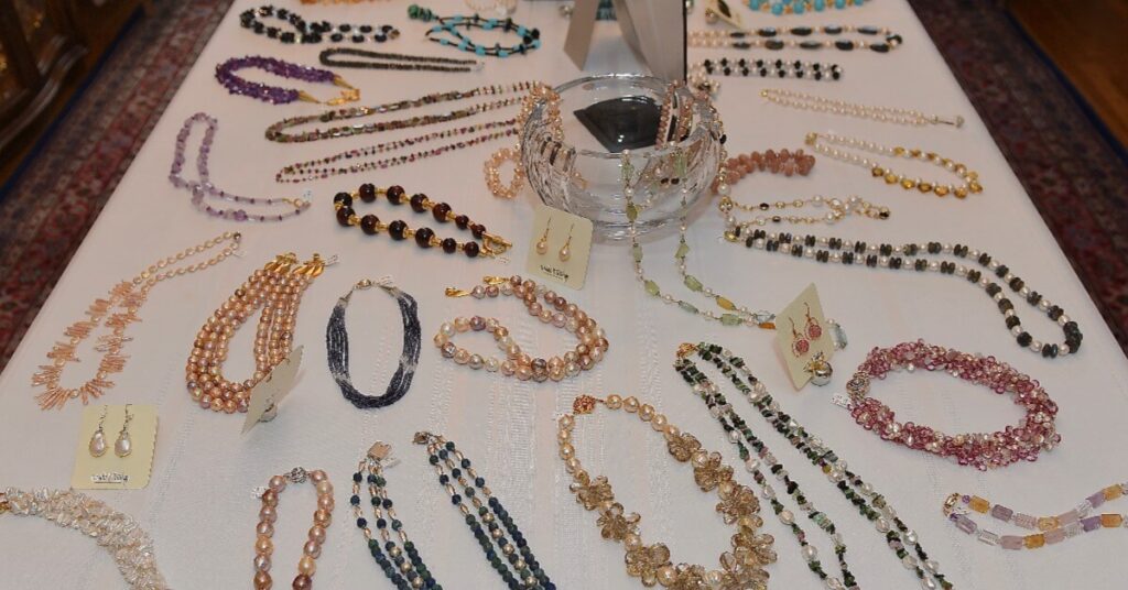 Image of handcrafted jewelry from Ursula K Design displayed on a table.